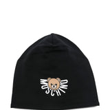 Cappello nero Moschino Kids in jersey con logo e orsetto Teddy stampato. Un accessorio comodo e stiloso per look casual e urban dei più piccoli.