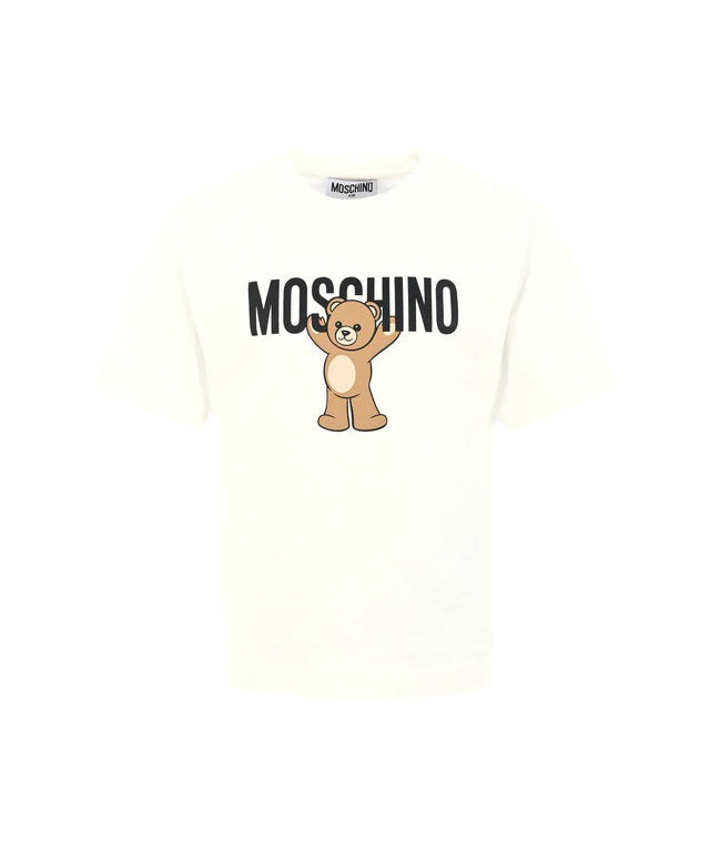 T-shirt panna Moschino Kids in cotone con stampa orsetto Teddy e logo. Comfort e stile per un look casual e riconoscibile ogni giorno.