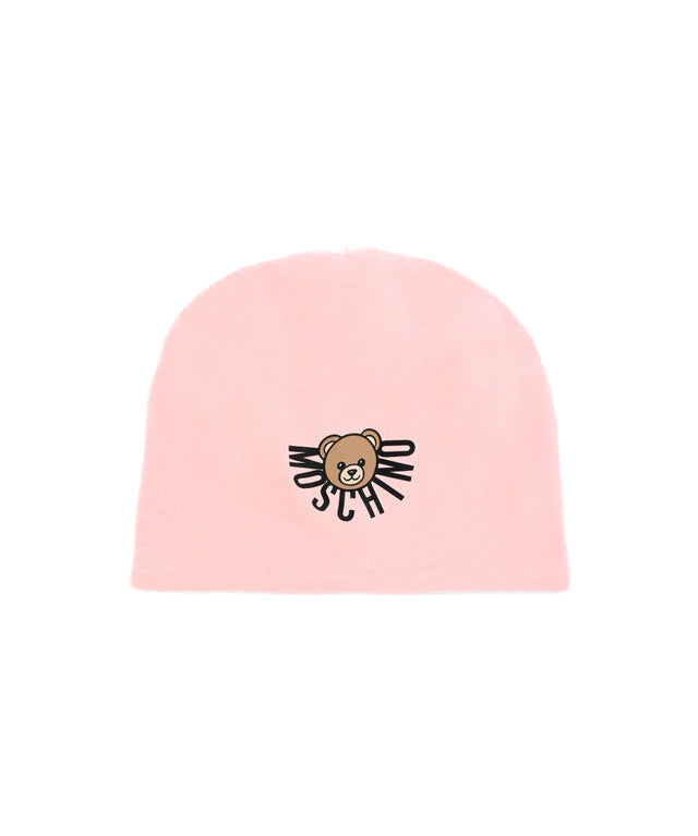 Cappello rosa Moschino Kids con sovrastampa orsetto Teddy e logo. Un accessorio trendy e confortevole per completare ogni look con stile.