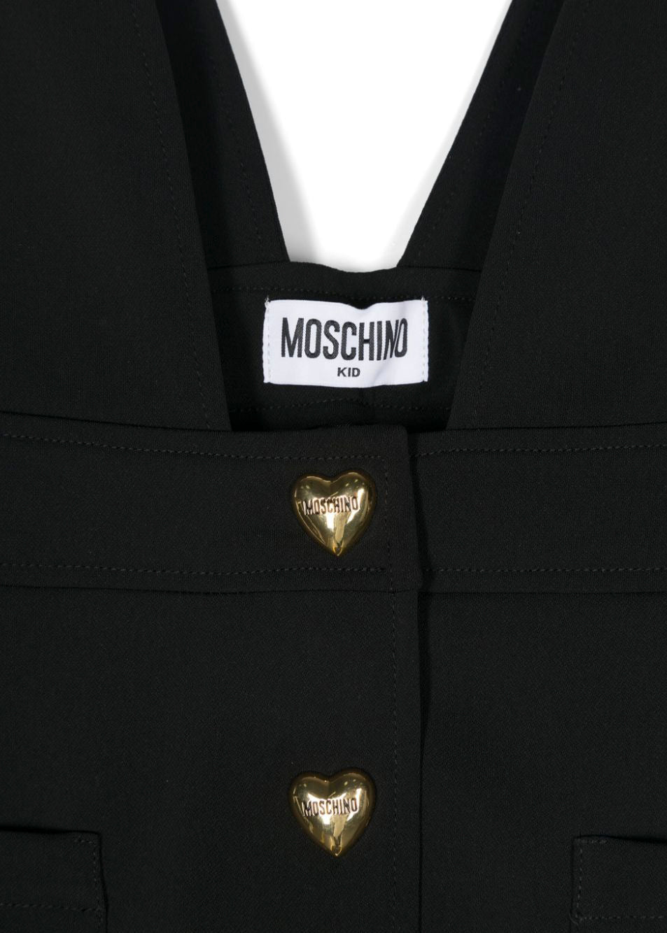 Moschino Kids Salopette Nera con Bottoni a Cuori Logati per Bambine (dettaglio)