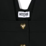 Moschino Kids Salopette Nera con Bottoni a Cuori Logati per Bambine (dettaglio)