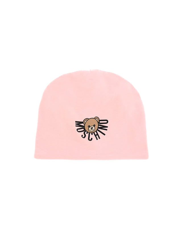 Cappello rosa Moschino Kids con sovrastampa orsetto Teddy e logo. Un accessorio trendy e confortevole per completare ogni look con stile.

