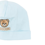 Moschino Kids Set Bavetta+Cappellino Celeste per Neonati
