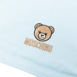 Moschino Kids Set Bavetta+Cappellino Celeste per Neonati