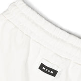 Eleganza sportiva per i più piccoli: Pantaloni Sportivi a Gamba Larga MSGM Kids - Bianco Crema con Logo Applicato