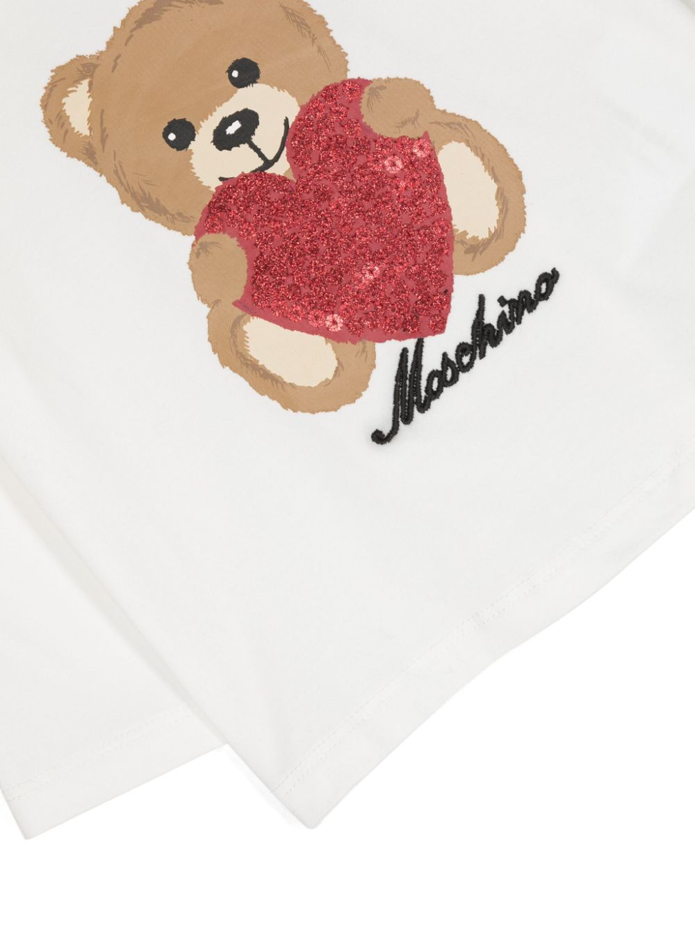 T-shirt Bianca Teddy Bear Cuore Moschino Kids: Dolcezza e Stile per le Piccole Fashion Icon