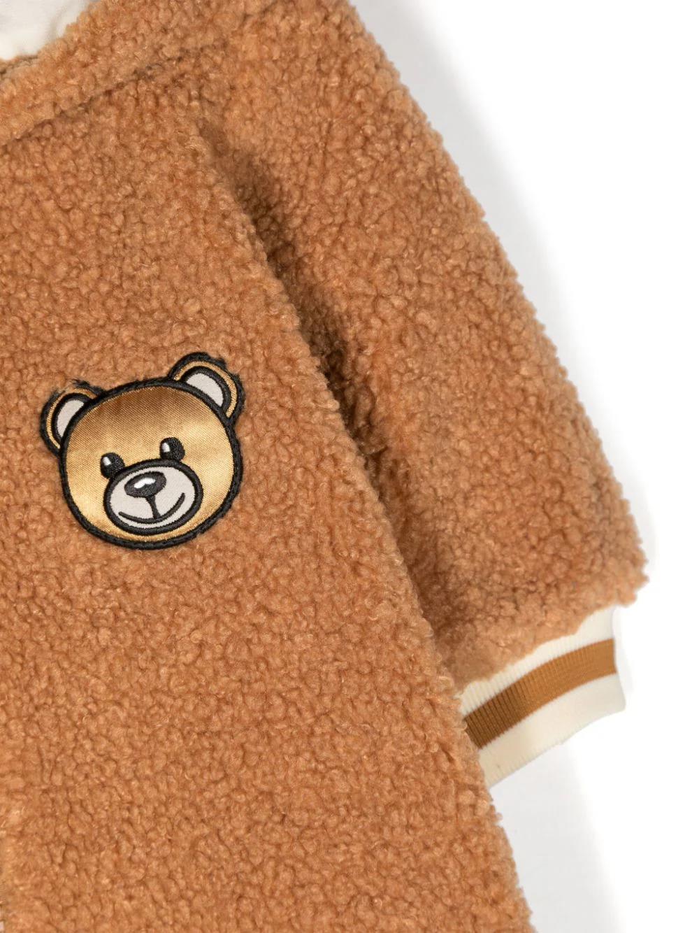 Tutina Moschino Kids Color Caramello con Cappuccio Teddy: Comfort e Stile per il Tuo Bambino